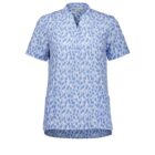 A short-sleeved, light blue blouse with a white and darker blue abstract dot pattern. The blouse has a V-neckline and a relaxed fit.