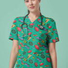 A person wearing green scrubs adorned with various colorful patterns including footballs, pizzas, and sneakers. They have a stethoscope around their neck and a watch on their wrist, standing against a solid light green background.