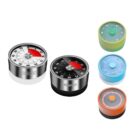 A collection of five kitchen timers featuring different designs and colors. Two are metal with red and black dials, while the others have plastic casings in green, blue, and orange with circular dials and digital or analog displays.