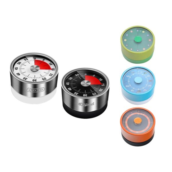 A collection of five kitchen timers featuring different designs and colors. Two are metal with red and black dials, while the others have plastic casings in green, blue, and orange with circular dials and digital or analog displays.