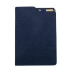 A blue fabric notebook with a black pen secured inside. The notebook is closed, and the pen is partially visible at the top right corner.