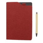 A closed red notebook with a textured cover, partially covering another notebook underneath, lies next to a beige pen with a silver clip on a plain surface.