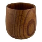 A round wooden cup with smooth grain patterns and a carved logo on the front featuring a circle enclosing 1/7. The cup has a natural finish, highlighting its rustic appearance.
