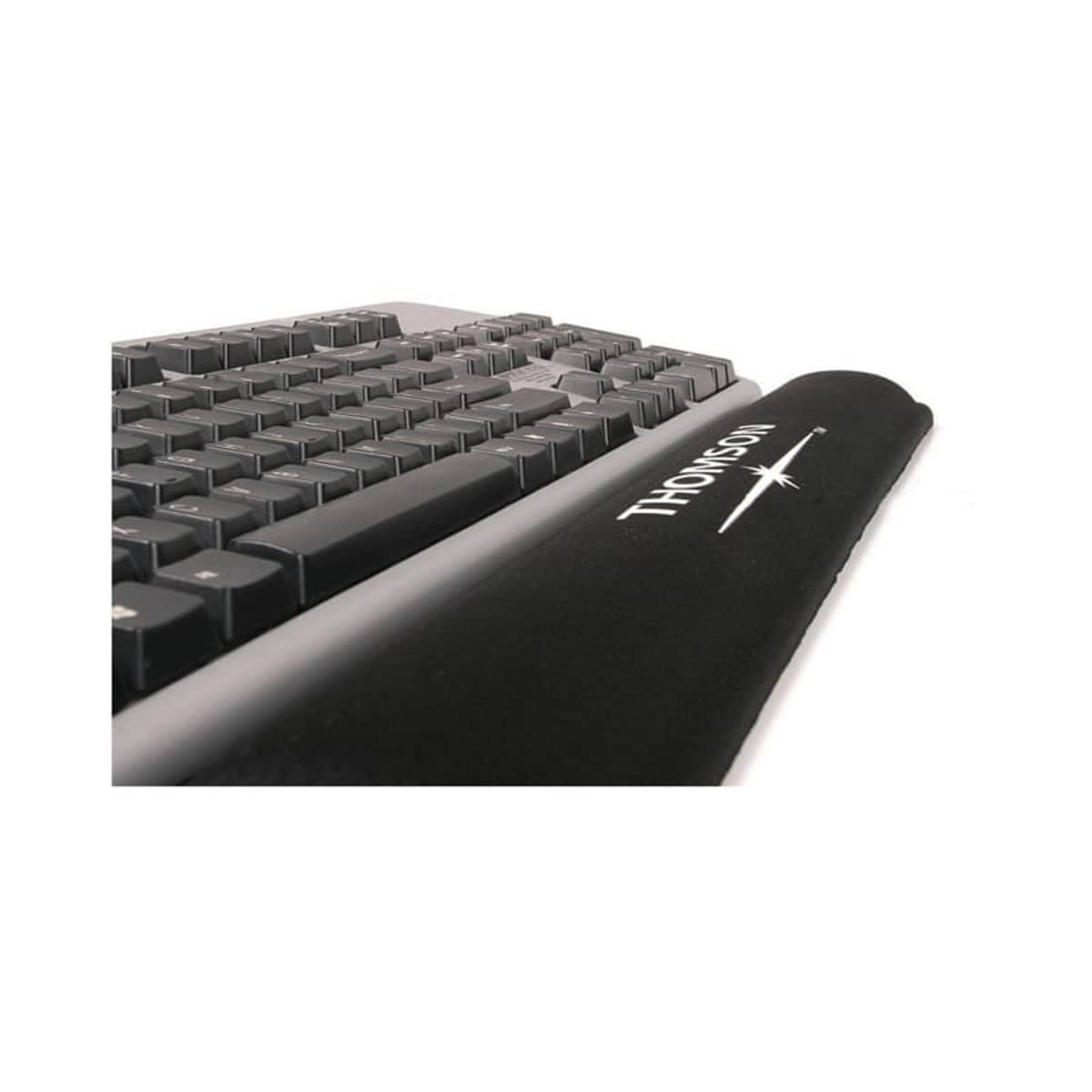 A close-up of a black computer keyboard with a padded wrist rest in front, featuring the word Thomson printed on it. The keyboard is angled from the front right corner, showing the keys in perspective.