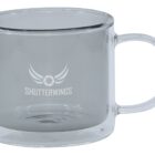 Clear glass mug with SHUTTERWINGS logo and wing design printed on the side.