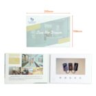 Open white promotional booklet with dimensions labeled 210mm by 148mm. On the left, an image and text describing services. On the right, a screen with buttons below displaying phones. Cover reads Live the Dream with logo at the top left.