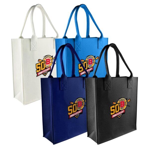 Four tote bags in different colors—white, light blue, dark blue, and black—feature a 50th Anniversary Baseball logo with crossed bats. The bags have handles and are displayed against a plain white background.