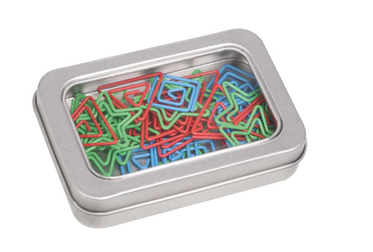 A metal tin with a transparent lid containing colorful, triangle-shaped paper clips in green, red, and blue.