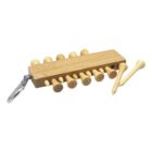 A wooden golf tee holder with a metal clip attached. Several wooden golf tees are inserted into the holder, with two additional tees lying beside it.