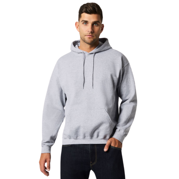 Man in Gildan Heavyblend hoodie standing against a white background.