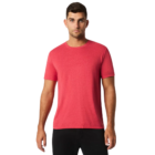 Man in a red Gildan Softstyle Tri-Blend T-shirt and black pants on white background.