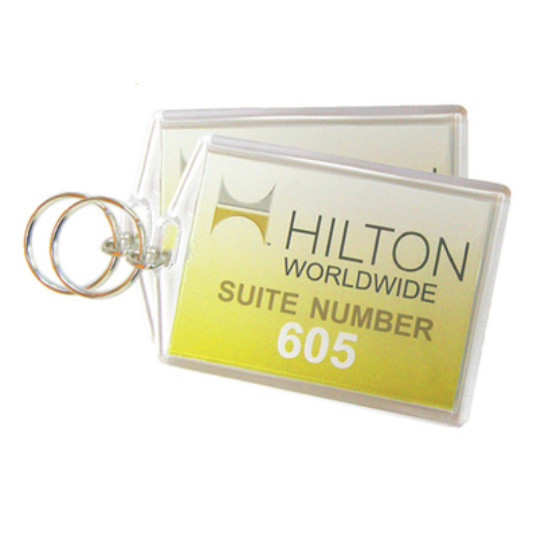 Hotel Room Plastic Keychain, two labeled SUITE NUMBER 605, on a yellow background.