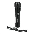 A black flashlight with a textured grip and a prominent power button in the center. It has a wrist strap attached at the base. The flashlight has brand markings and is positioned upright on a plain white background.
