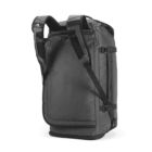 Gray backpack standing upright, showing adjustable padded shoulder straps. The material appears durable, with a textured design, multiple zippers, and buckles for adjustments. The top handle is visible, providing versatility for carrying options.