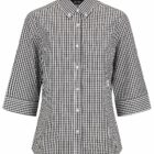 A black and white checkered blouse with three-quarter length sleeves and a button-up front. The collar is pointed, and the fabric has a small gingham pattern.