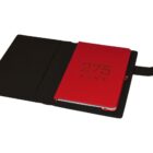 Open black leather folder with a red notebook inside. The notebook cover features the number 275 and the word KENT embossed in black. The folder has a strap closure on the right side.