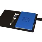 Open black folio case displaying a blue notebook with 275 KENT on the cover, a pen in a holder, and several cards in pockets.
