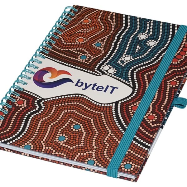 A spiral-bound notebook with a colorful dot pattern cover and a blue elastic band. The cover features the text byteIT with a logo.