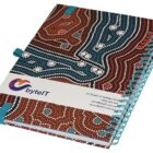 A spiral-bound notebook with a colorful dot art pattern cover and a teal elastic band. A white paper band across it features the logo and contact details for byteIT.