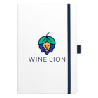 A white notebook with a navy elastic band and pen holder. The cover features a stylized lion logo in blue and green resembling a hop cone, with the text WINE LION beneath it.