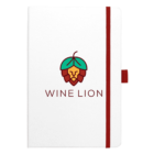 A white notebook with a red elastic band and pen loop. The cover features a logo of a lions face stylized with green grape leaves and the text WINE LION in red below it.