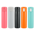Five insulated travel mugs are lined up in a row against a white background. The mugs are in different colors: pink, light gray, black, orange, and teal. Each mug has a secure flip-top lid.