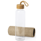 Clear glass water bottle with a bamboo lid and rope handle, next to a burlap sleeve.