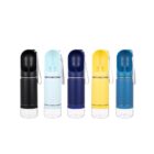 Five reusable water bottles in a row, each with a cylindrical shape and a strap for carrying. Colors from left to right: black, light blue, navy blue, yellow, and teal. Each bottle has a clear bottom section.