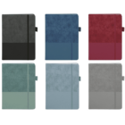 Six notebooks in two-tone designs are displayed. Colors include black and gray, blue, red, green, teal, and light gray. Each notebook has a black elastic band and a pen loop on the side.
