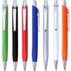 Seven ballpoint pens standing upright in a row. The pens have shiny silver tips and clips, with bodies in various colors: green, black, red, blue, gray, white, and orange.