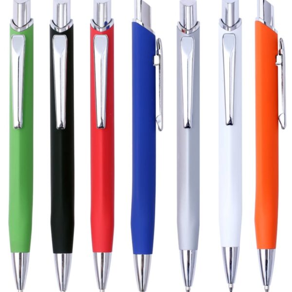 Seven ballpoint pens with silver clips and tips stand upright. The pens are colored green, black, red, dark blue, light grey, white, and orange.