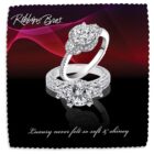 Two diamond rings with intricate settings are displayed against a dark, wavy red and purple background. The text Robbins Bros. is at the top and Luxury never felt so soft & shiney is written at the bottom.