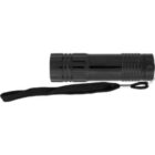 A black cylindrical flashlight with a textured grip and a black wrist strap attached. The flashlight is positioned horizontally with the strap extending from the bottom end.