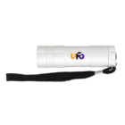 A white flashlight with a black wrist strap attached. The flashlight has the word Ufo printed on its side in orange and purple letters.
