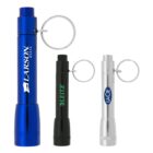 Three small flashlights with key rings attached. The flashlights are blue with LARSON BOATS text, black with LEITZ text, and silver with LACIE text. Each flashlight has a cylindrical shape with a simple design.
