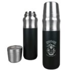Two stainless steel thermoses with black bodies are shown. One is closed with a cup lid, and the other is open, displaying its shiny interior. Both thermoses feature the Trailblazer Outfitters logo and the motto Gear Up for Adventure.
