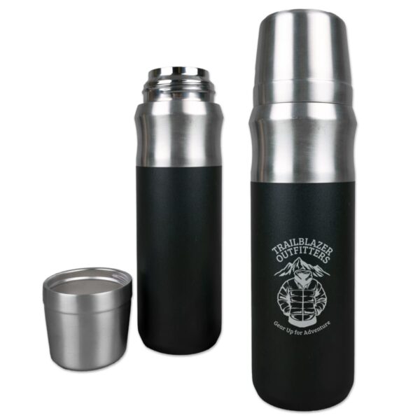 Two stainless steel thermoses with black bodies are shown. One is closed with a cup lid, and the other is open, displaying its shiny interior. Both thermoses feature the Trailblazer Outfitters logo and the motto Gear Up for Adventure.