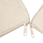 Close-up of two beige fabric pouches with metal zippers, positioned at an angle. The material has a textured, natural look, and the zippers are partially closed, with the pulls facing upwards.