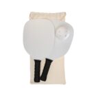 Two white pickleball paddles with black handles and a white ball lie on a beige drawstring bag. The paddles and ball are arranged neatly, showcasing the pickleball set.