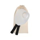 A pickleball set featuring two paddles with black grips and a white ball with holes, placed in front of a beige drawstring bag on a white background.