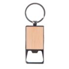 A rectangular keychain with a metallic frame and a wooden insert. The keyring is attached at the top. Below the wooden part is a metal bottle opener.
