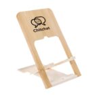 A wooden phone stand featuring the Chitchat logo, which includes a speech bubble and a smiling face. The stand has a minimalist design with a slot for holding a device upright.