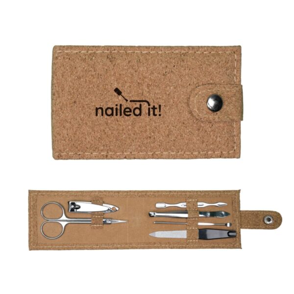 A cork-textured manicure set lying open and closed, displaying nail scissors, clippers, tweezers, a cuticle pusher, and a nail file. The closed case features the words nailed it! with a snap button closure.