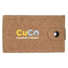 A rectangular cork wallet with white stitching and a snap button closure. The wallet features the brand name CuCo Curated Colours in yellow, white, and blue text on the front.