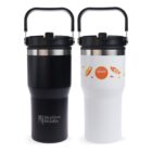 Two travel mugs with handles are shown. The left mug is black with the Skyline Studio logo, while the right mug is white with autumn-themed designs and the Coastal Breakers logo.