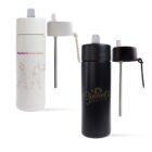 Two insulated water bottles with pump-style lids. One is white with a pink illustration of dancers and the text Euphoria Dance Center. The other is black with the gold text Opulent Beauty Co. Both have silver dispensing straws.