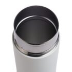 Close-up of the top view of a stainless steel insulated bottle with a wide opening. The bottles interior is shiny and metallic, contrasting with its matte white exterior.
