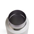 A close-up of an open stainless steel thermos with a white exterior. The lid is removed, revealing a smooth, reflective inner surface. The background is plain and white.