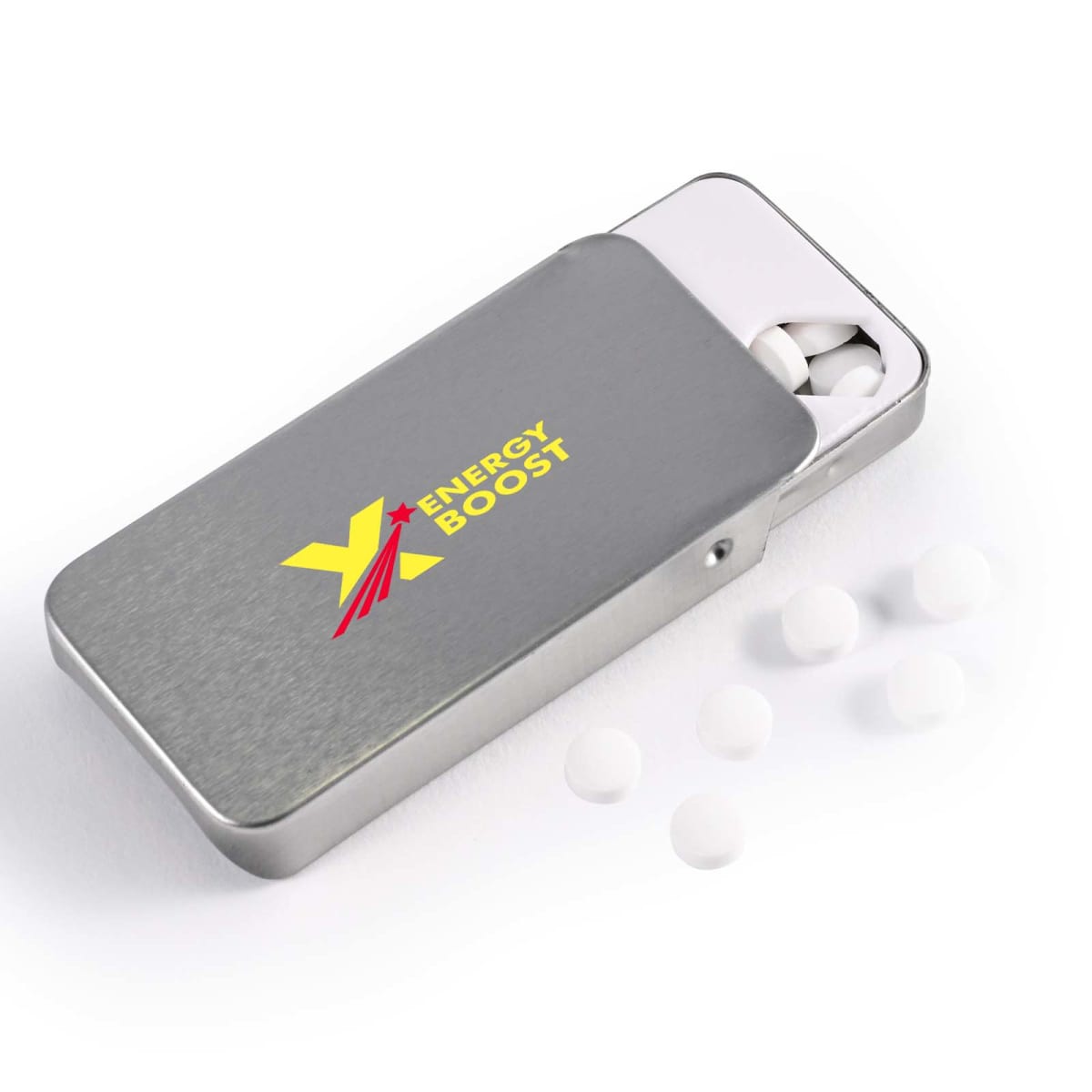 A rectangular metallic tin labeled Energy Boost with a yellow and red design is open, revealing small white tablets inside. Several tablets are scattered outside on a white surface.