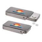 Two metal slide boxes with palm tree and sunset graphics. One box is open, revealing two white tablets on a sliding tray. Additional loose tablets are nearby.